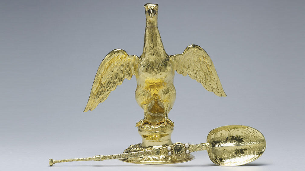 Ampulla, 1661 (RCIN 31732) and Coronation Spoon, 12th century (RCIN 31733) A gold flask shaped as a eagle and a large gold spoon with pearls and engraved with scroll details.