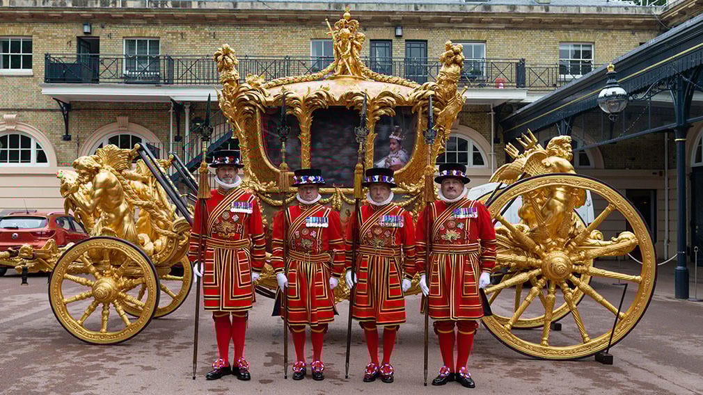 Yeomen of the Guard in front of the Gold State Coach Yeomen of the Guard stand in front of the Gold State Coach