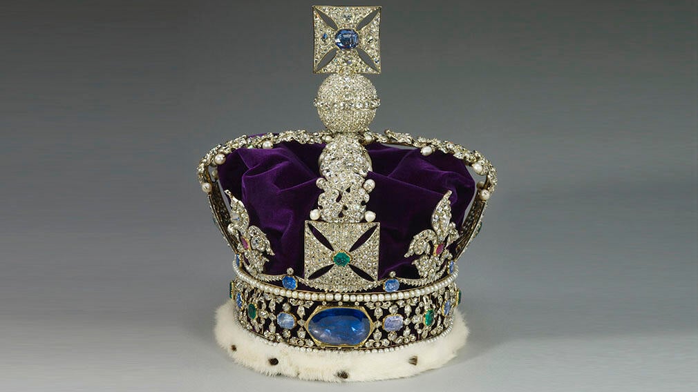 The Imperial State Crown, 1937 (RCIN 31701). St Edward's Sapphire can be seen here on the reverse of the crown. A crown set with thousands of diamonds, a purple velvet cap and a large sapphire in the centre