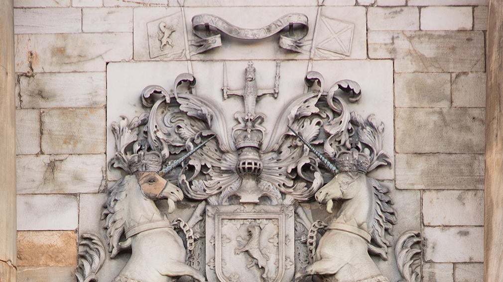 Unicorns above the front door of the Palace Two unicorns facing each other carved in stone