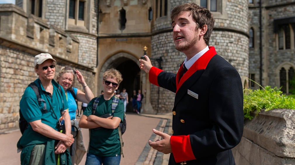 Windsor Castle warden with visitors Windsor Castle warden with visitors