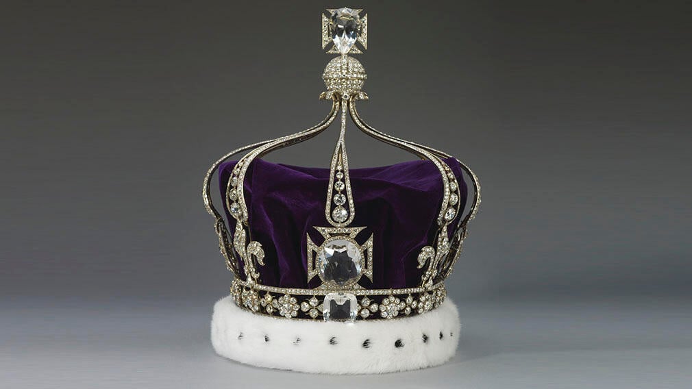 Queen Mary's Crown, 1911 (RCIN 31704). The three rock crystal replicas are shown here. A silver crown with thousands of diamonds and a purple velvet cap.