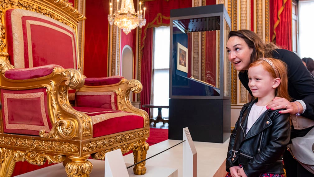 The Throne Room, Buckingham Palace Adult and child look at throne in the Throne Room, Buckingham Palace